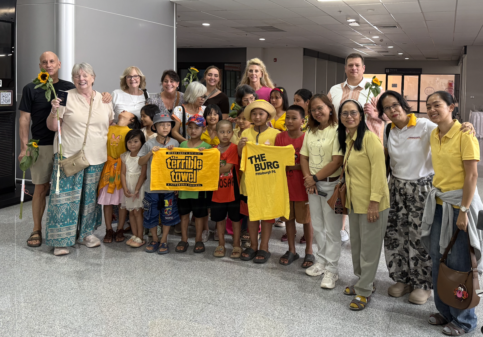 Faith House staff and girls welcoming the team at Mae Sot Airport